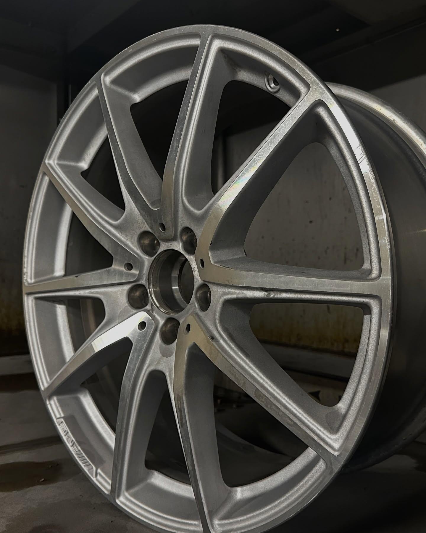 Damaged AMG alloy wheel before repair at South West Alloys