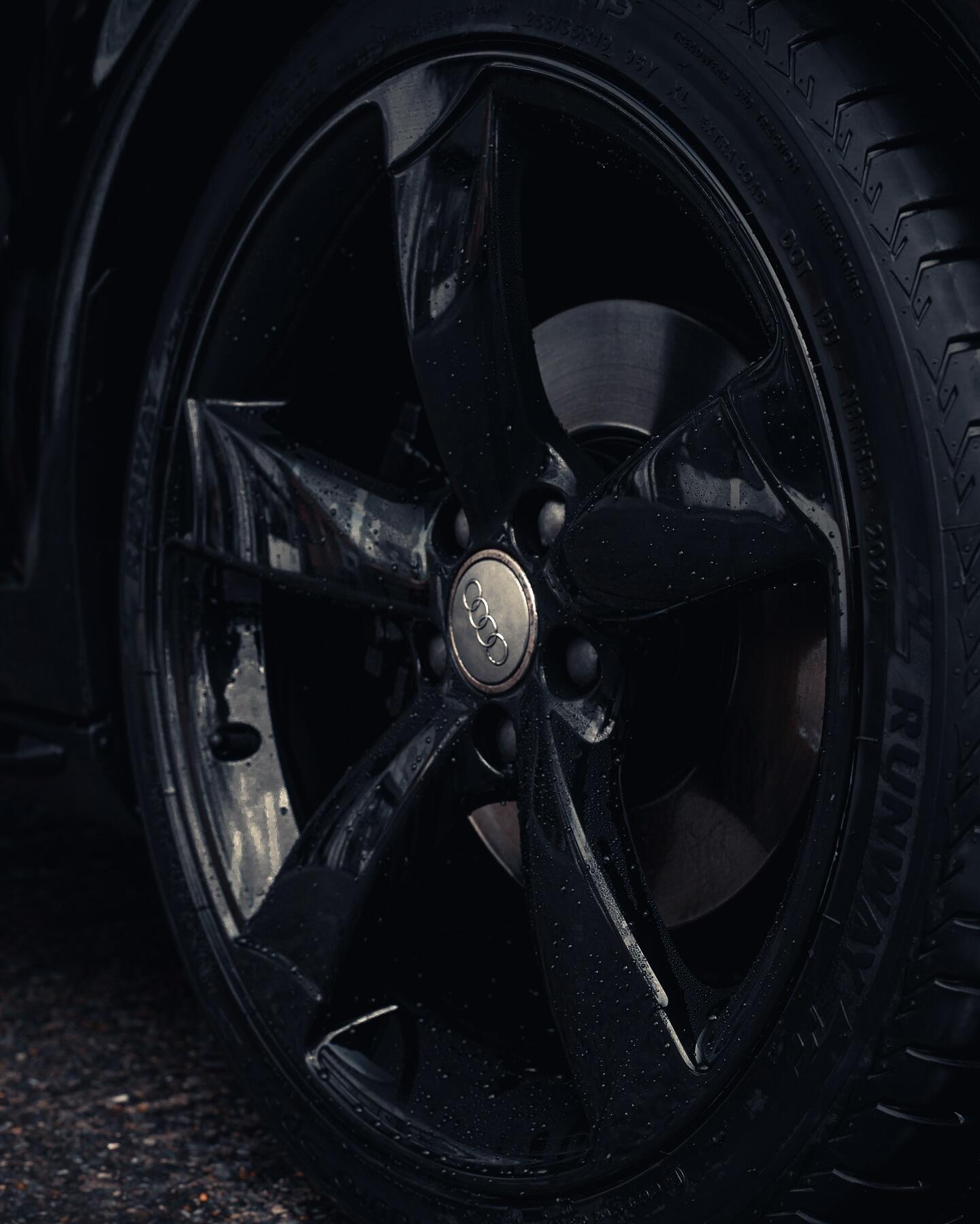 Audi gloss black custom wheel finish showing deep reflective coating