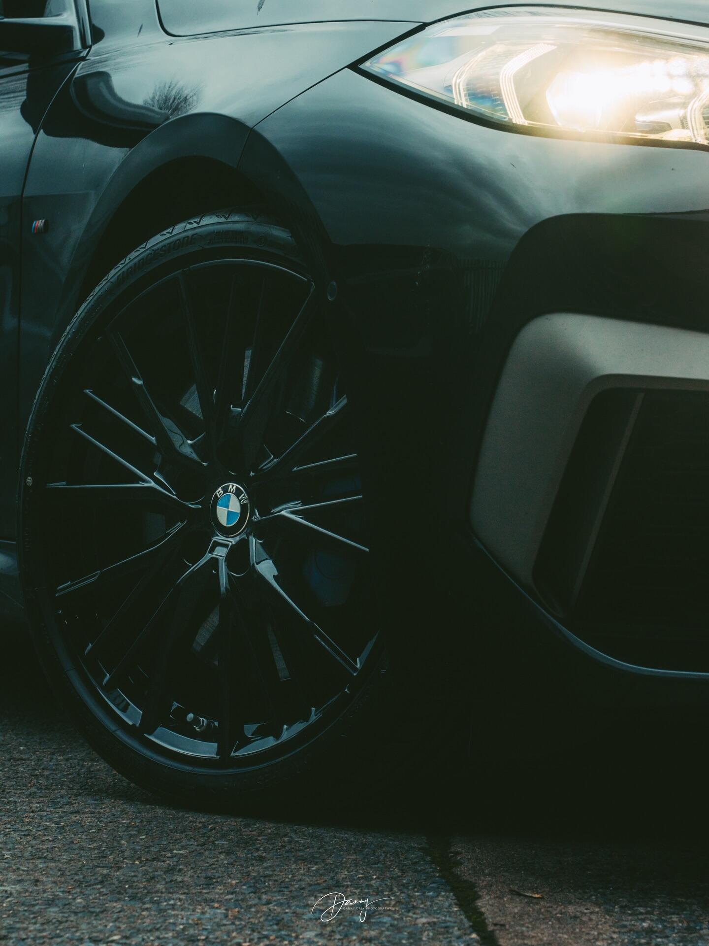 BMW dark wheel and headlight detail shot