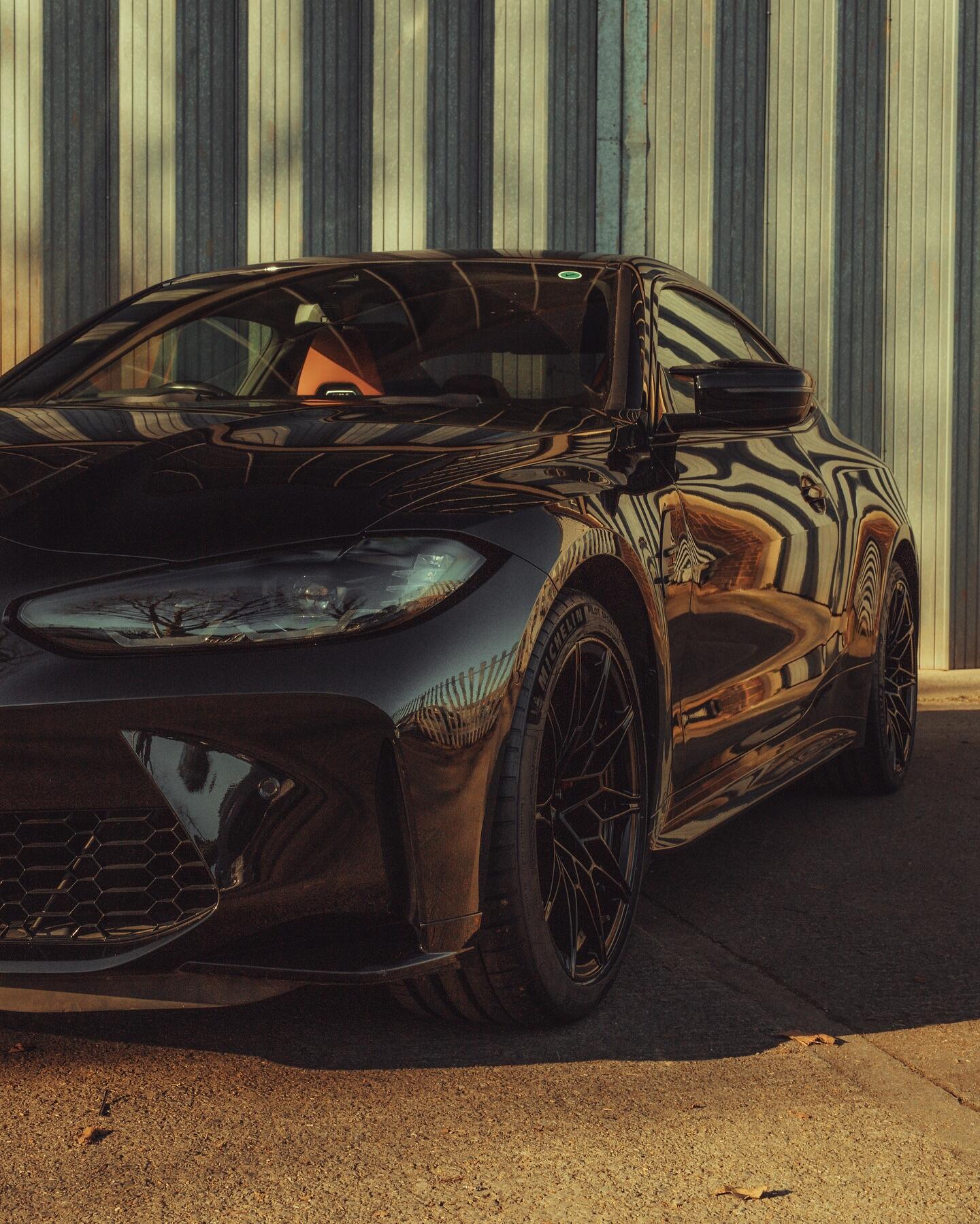 BMW M4 side angle showing alloy wheel refurbishment