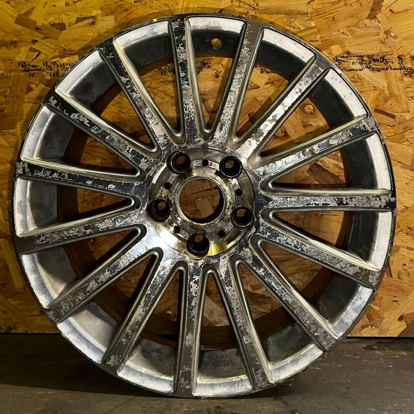 Damaged alloy wheel requiring professional cosmetic repair