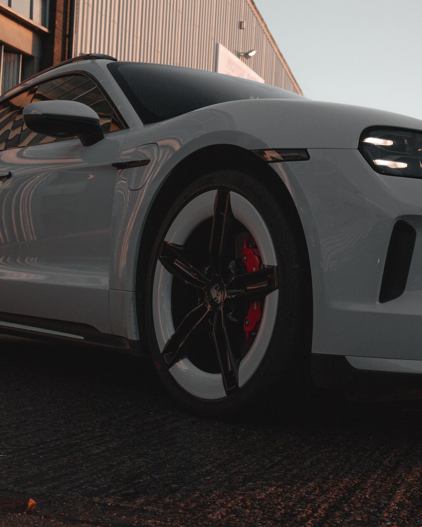 Porsche Taycan grey side view showing wheel refurbishment
