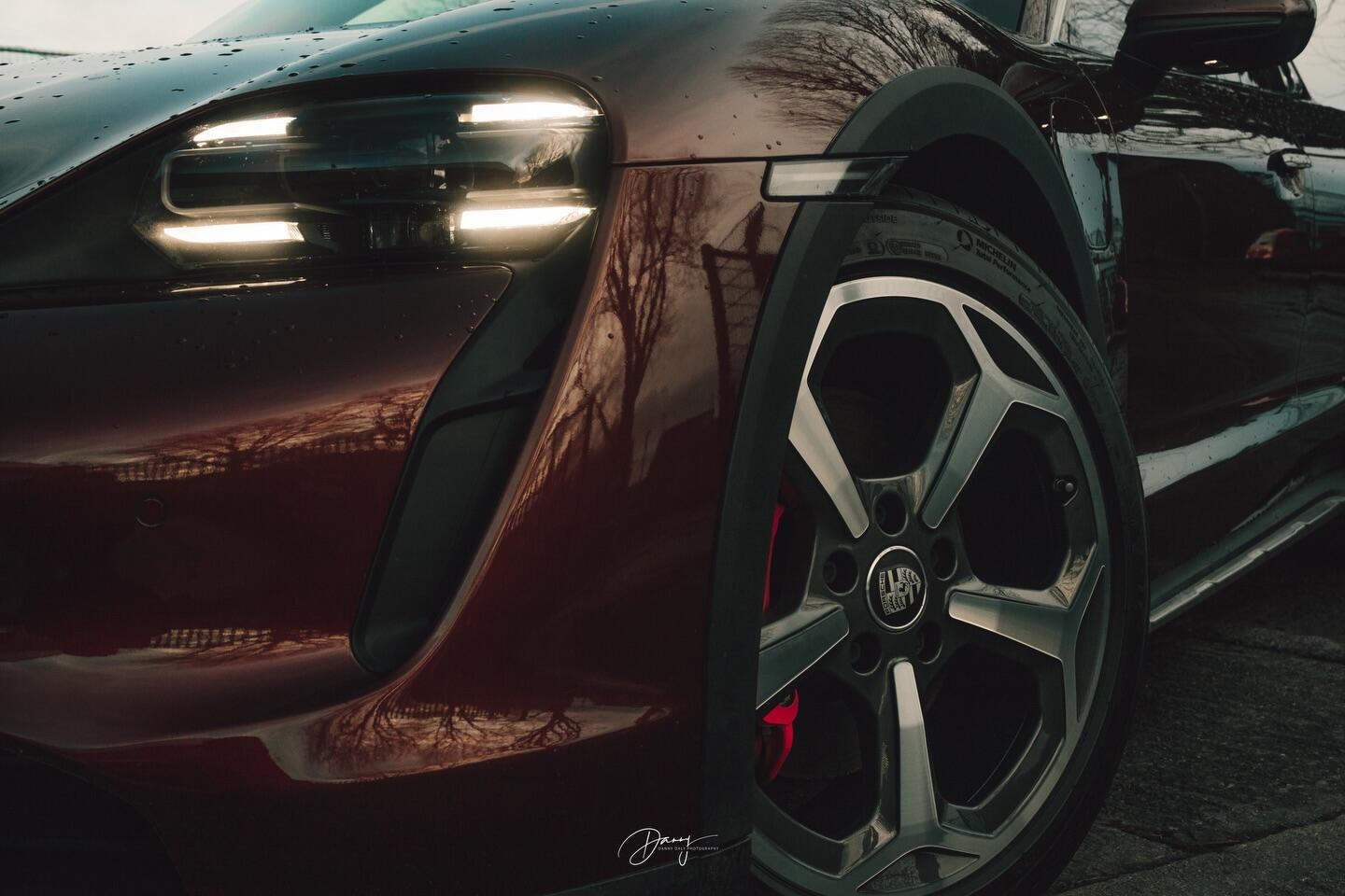 Porsche Taycan wheel close-up in dark setting