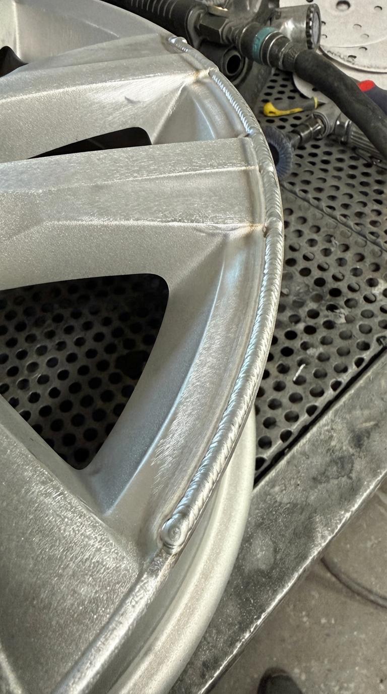Cracked alloy wheel before professional TIG welding repair